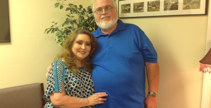 Husband and wife Mentor foster parents in South Carolina hugging
